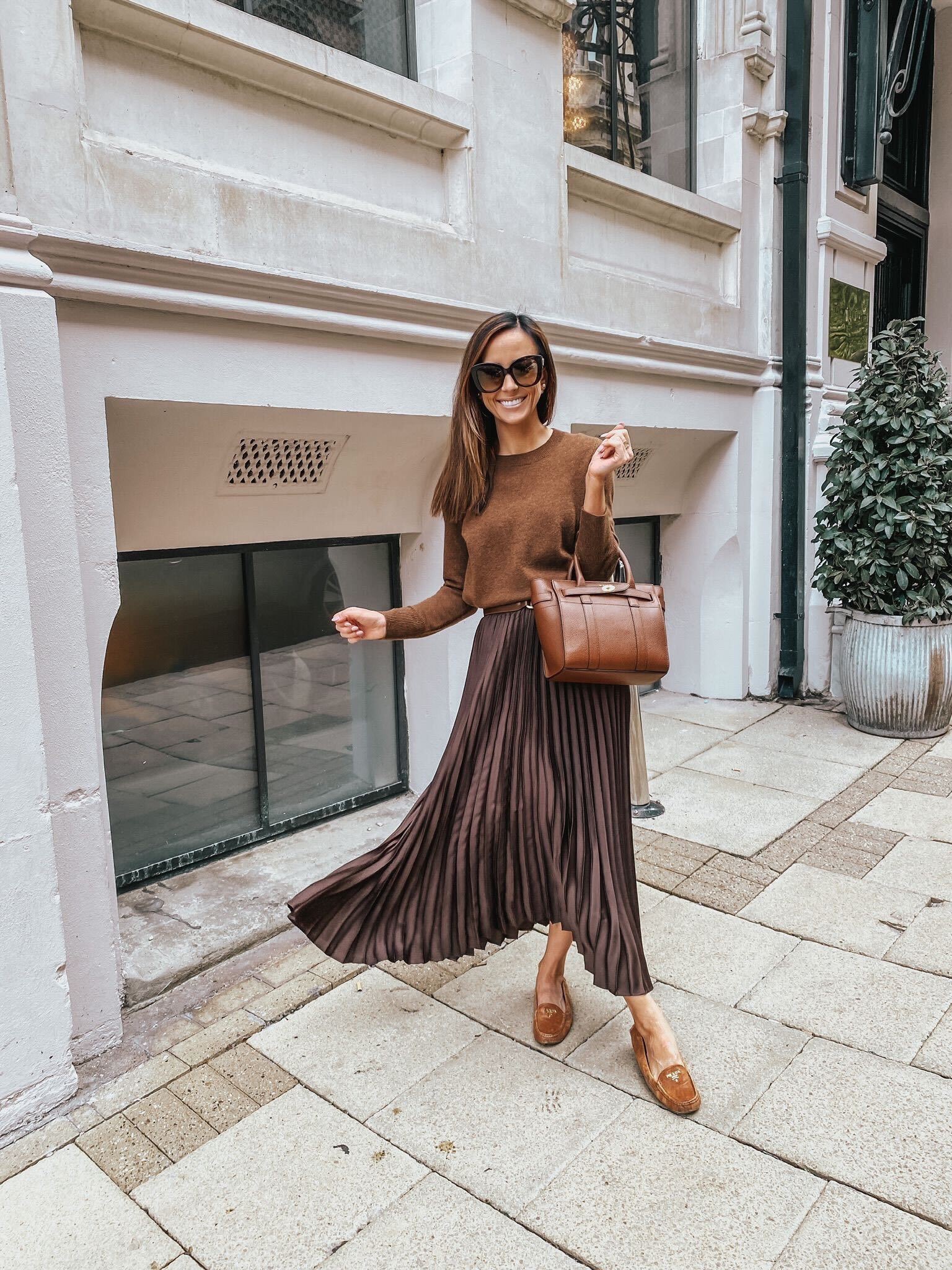 pleated skirt with a cashmere sweater, thanksgiving day outfit ideas