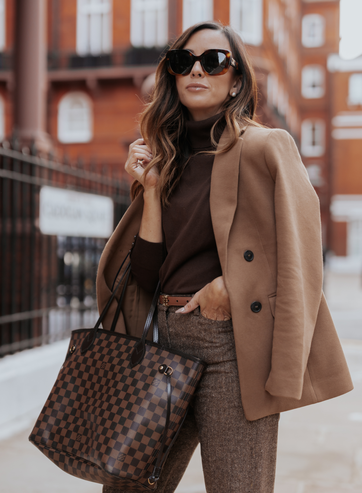 https://alysonhaley.com/wp-content/uploads/2023/10/brunette-woman-in-knightsbridge-london-high-waisted-textured-trousers-talbots-brown-turtleneck-sweater-talbots-camel-blazer-brown-gianvito-rossi-booties-autumn-outfit-inspiration-FEATURE-1.png