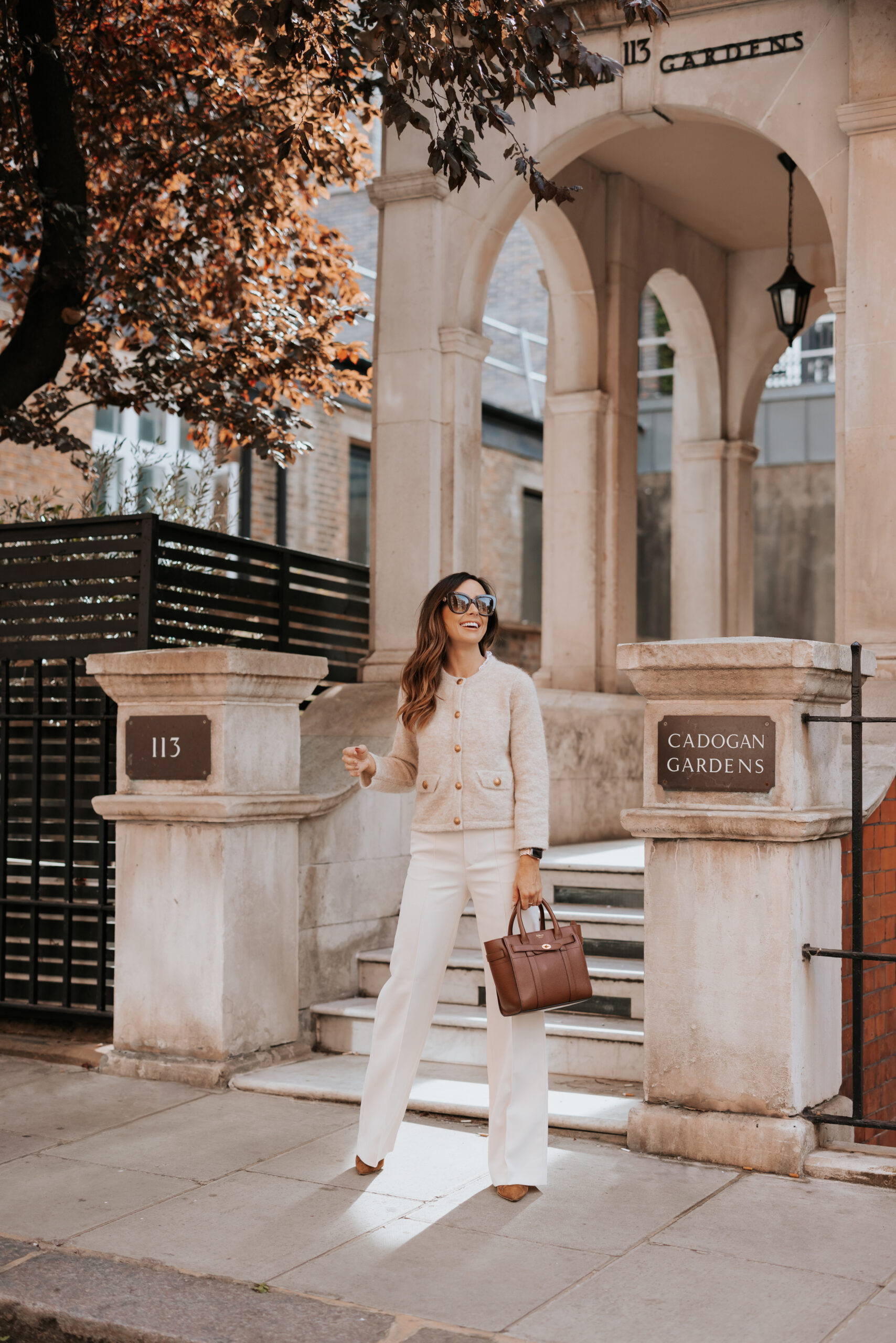 https://alysonhaley.com/wp-content/uploads/2023/10/brunette-woman-in-london-wearing-mango-suit-stripe-white-trousers-me-and-em-alpaca-bracelet-sleeve-knitted-jacket-gianvito-rossi-suede-piper-booties-fall-autumn-outfit-inspiration7-scaled.jpg